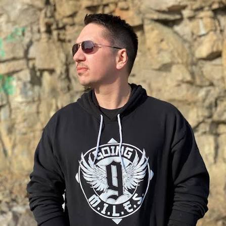 Dakota House wearing a Going MILES hoodie outdoors